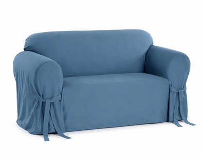 blue loveseat covered with a fitted slipcover on a white background